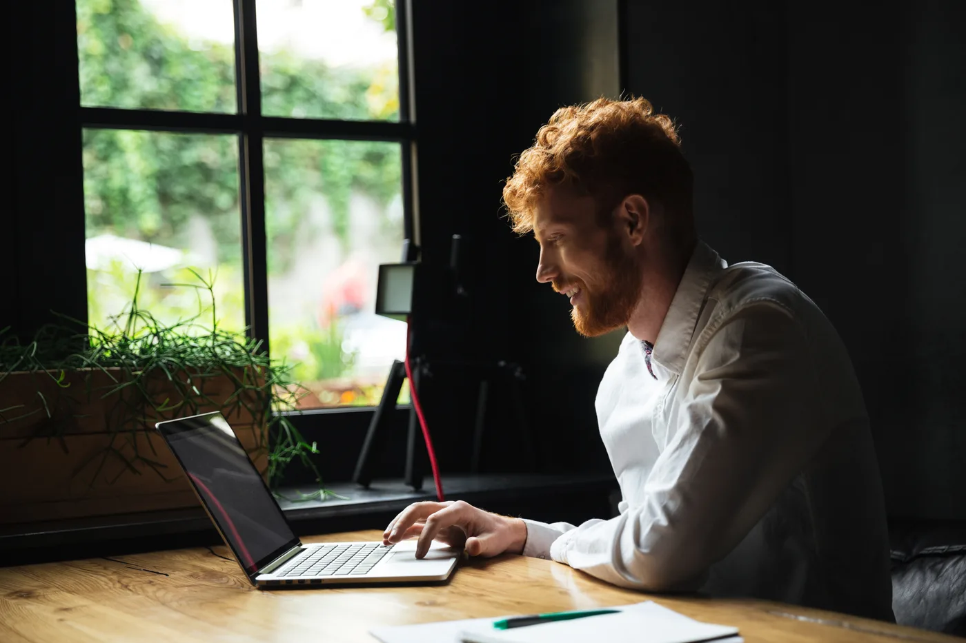 A support team member reviewing customer conversations on a laptop