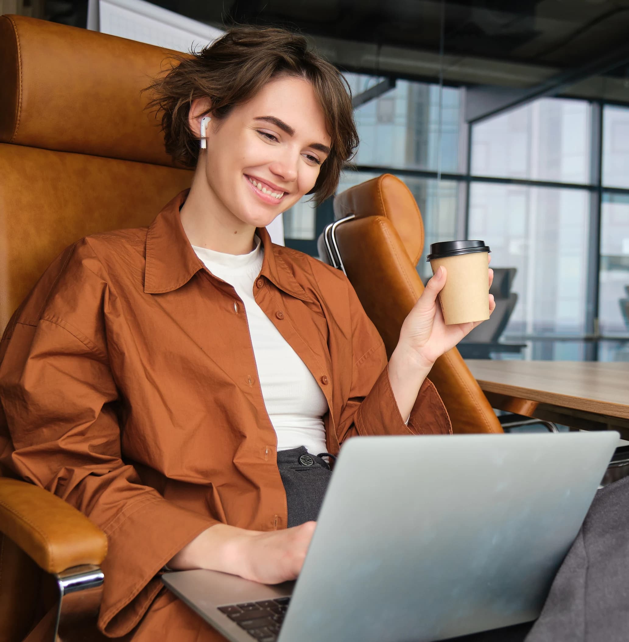 Customer support leader reviewing ticket automation on a laptop