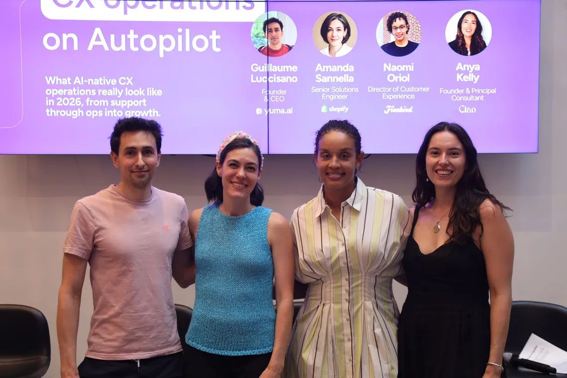 The Commerce on Autopilot panelists standing together in front of the stage