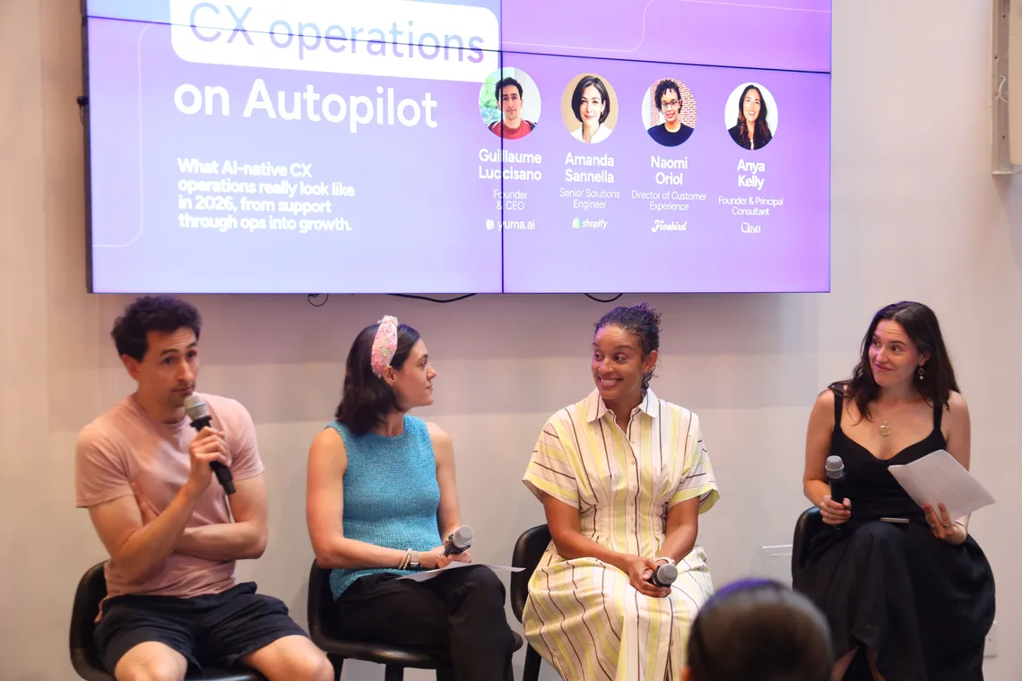 Two panelists speaking with microphones during the Commerce on Autopilot conversation