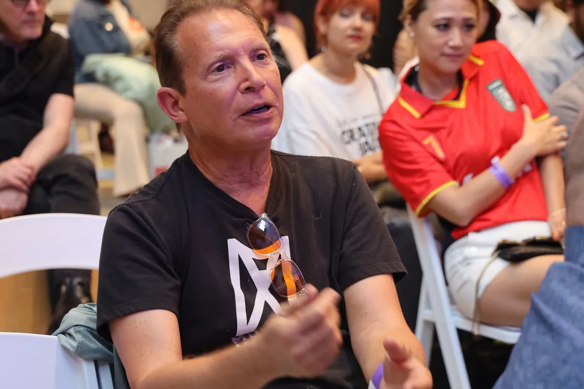An attendee asking a question during the audience Q&A